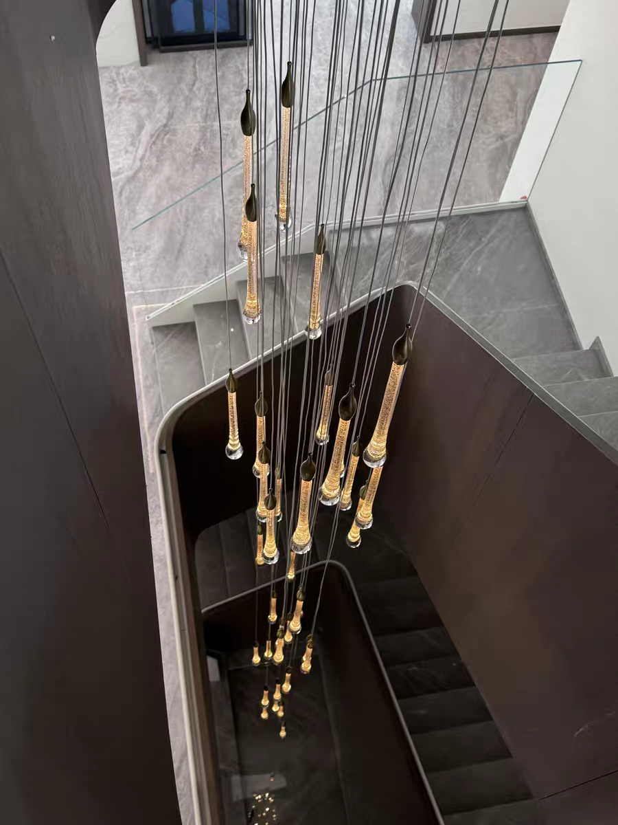 Illuminated 30-light random Crystal Drops Chandelier, casting a warm, sparkling glow.