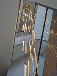 Thumbnail for The ambient effect of the celestial chandelier, casting soft, patterned light that enhances architectural details.
