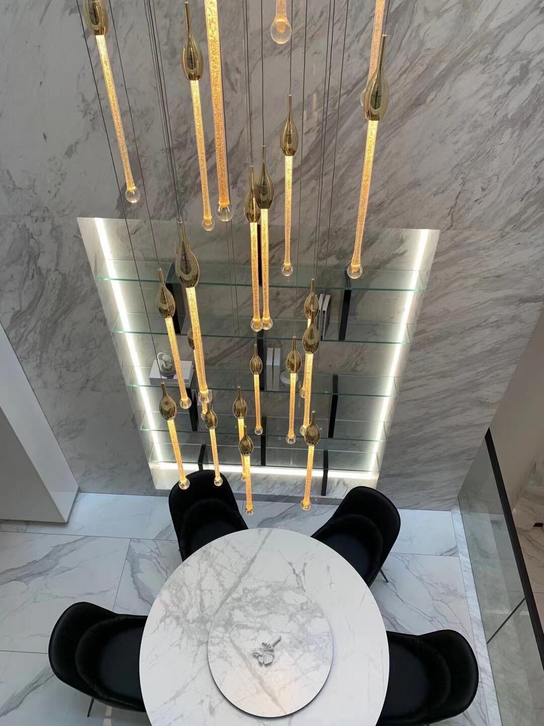 The ambient effect of the celestial chandelier, casting soft, patterned light that enhances architectural details.