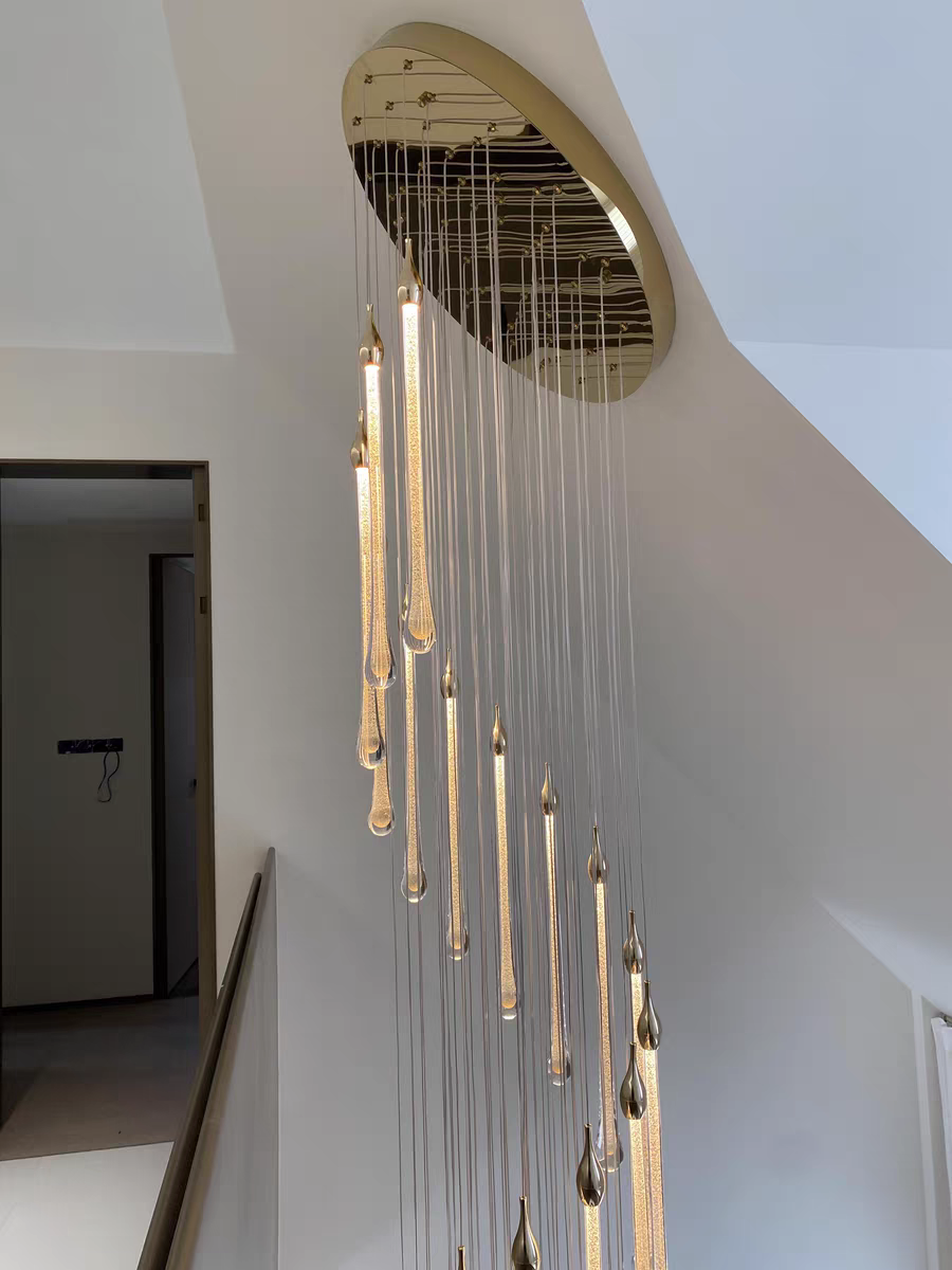 Detailed view of the chandelier’s gold canopy and LED integration, showcasing craftsmanship.