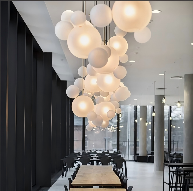 Modern interior with a large bubble chandelier in a dining area