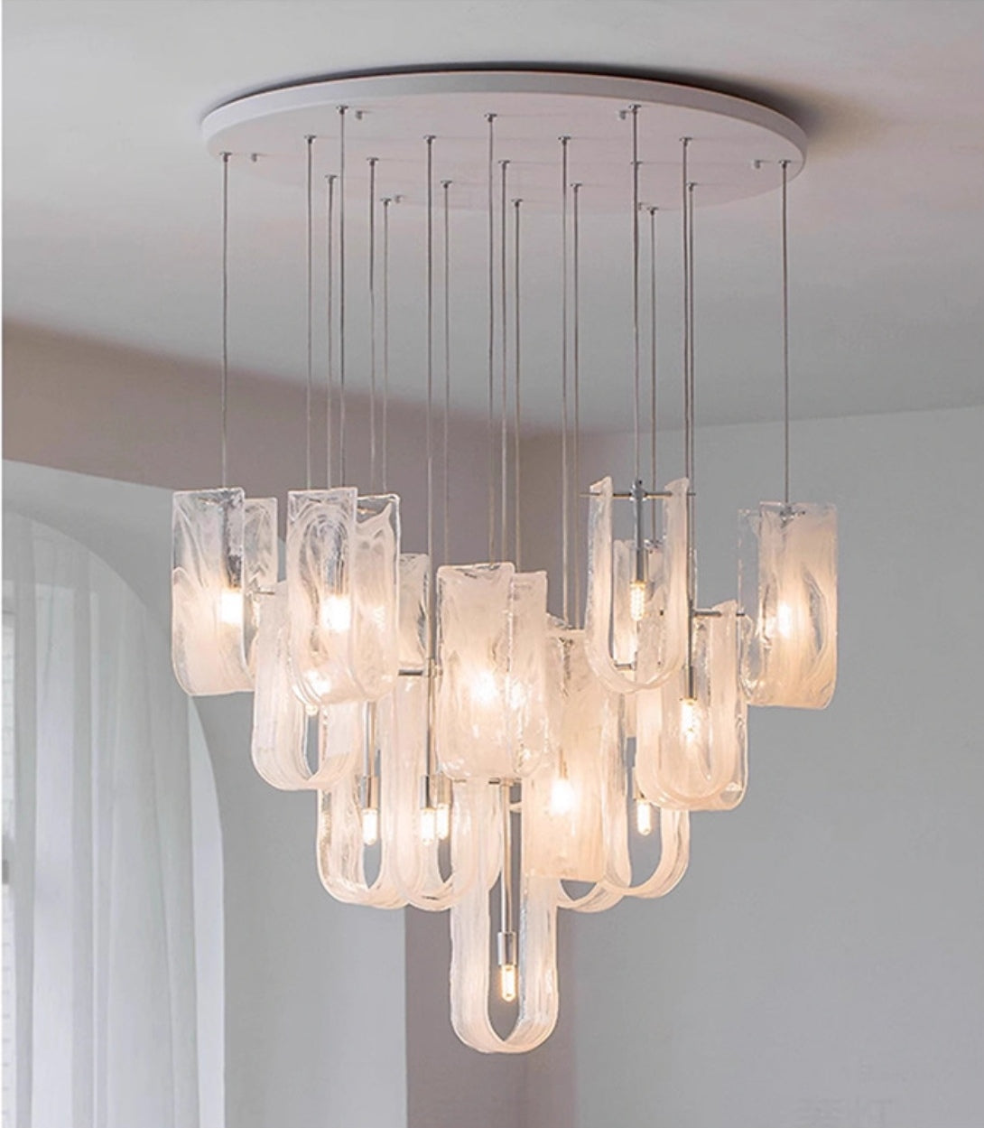 Side view of Nebula Wave Chandelier, showcasing elegant glass waves