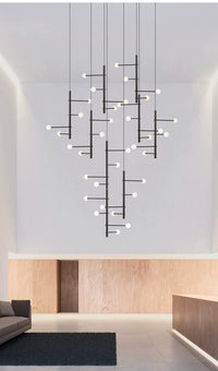 Thumbnail for The chandelier as a focal point, its white globes offering a soft contrast to darker interior elements.