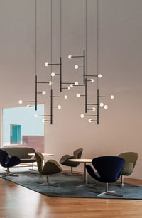 Thumbnail for The subtle warmth of the light emitted, depending on the bulb choice, diffused by the white globes.