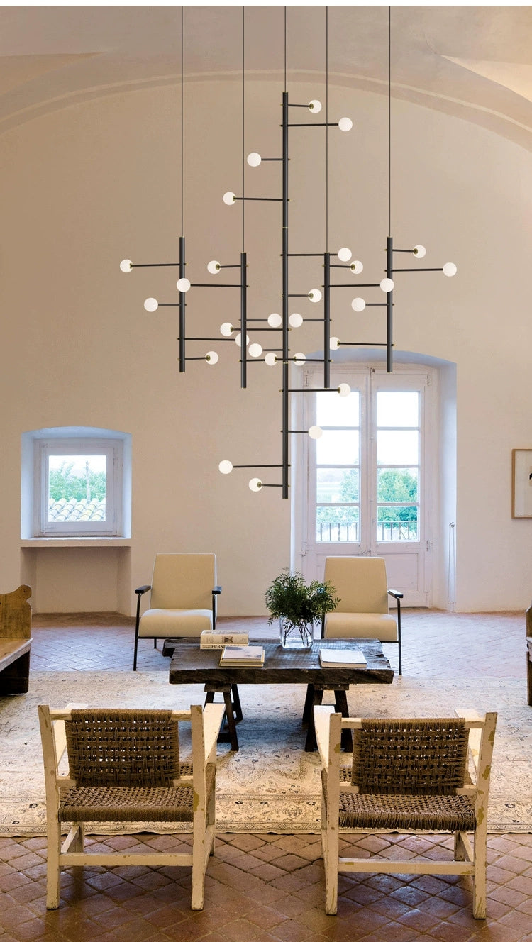 Lifestyle image of the 28-light mixed style chandelier (146 x 39.3 in) in a cozy dining space.