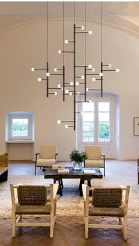 Thumbnail for Lifestyle image of the 28-light mixed style chandelier (146 x 39.3 in) in a cozy dining space.