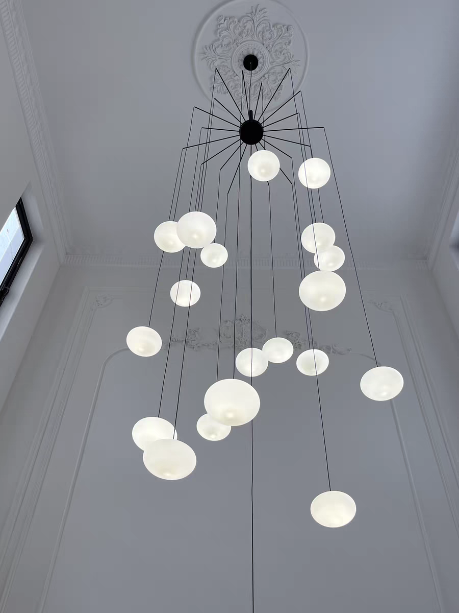 Lifestyle image of the chandelier in a modern dining room, creating a cozy ambiance.