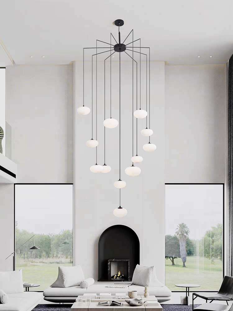 Pristine white glass pendants of the Modern White Glass Pendant Chandelier, viewed from the front, exude minimalist elegance.