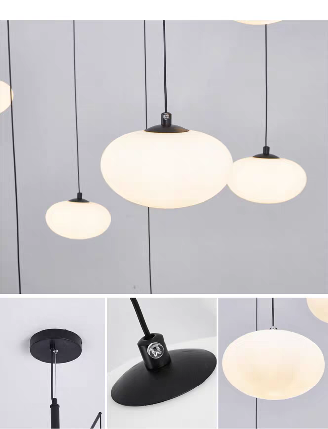 Close-up of a single white oval glass shade, emphasizing its clean, airy design.