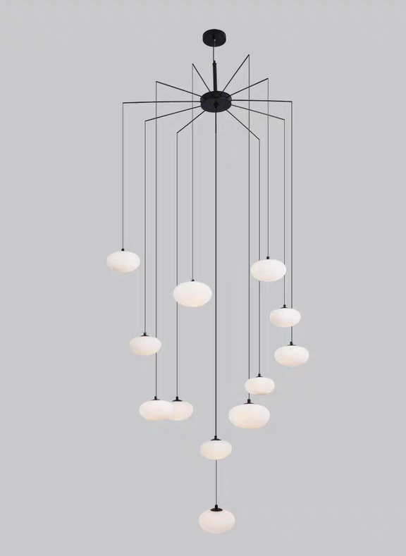 Overhead view of the chandelier, highlighting the arrangement of its white glass shades.