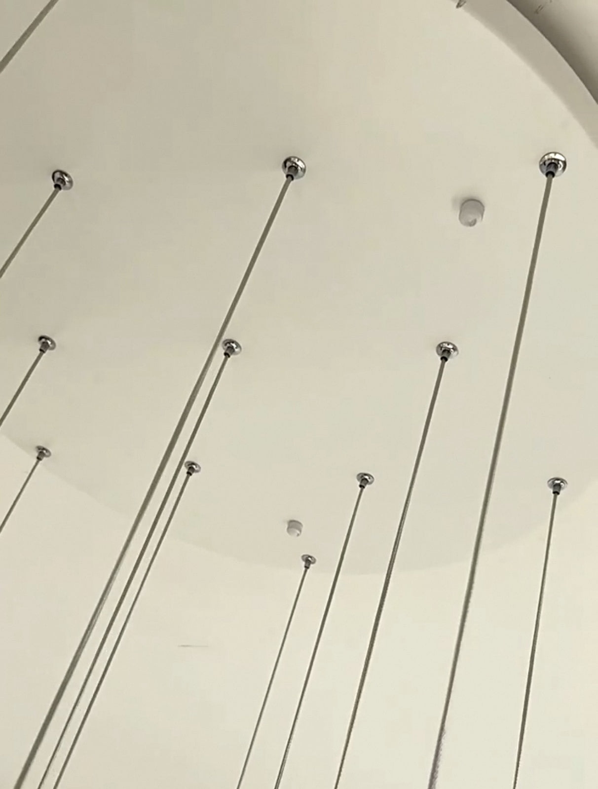 Detailed view of the durable metal canopy on Nebula Wave Chandelier, designed for secure installation