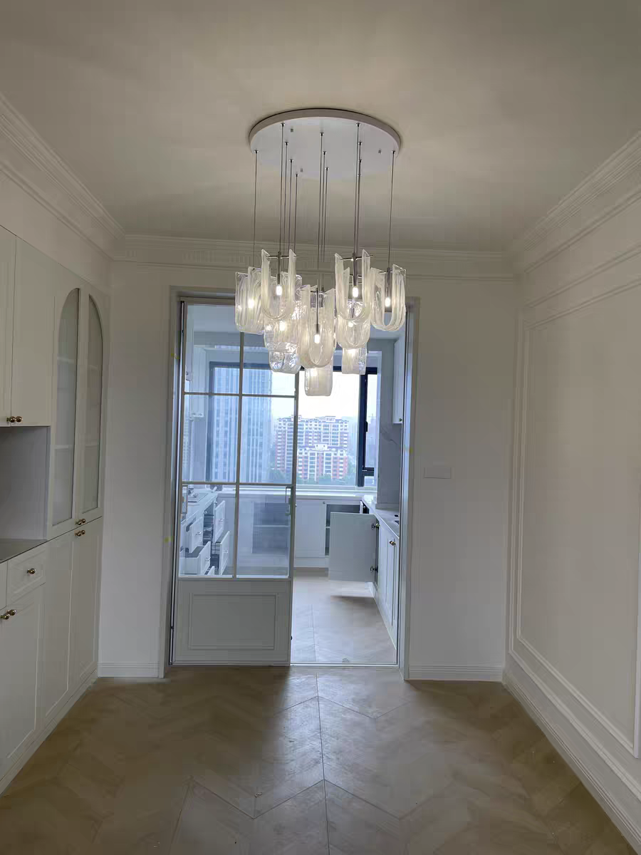 Nebula Wave Chandelier illuminating a stylish hallway, guiding guests with sophistication
