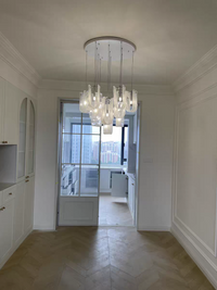 Thumbnail for Nebula Wave Chandelier illuminating a stylish hallway, guiding guests with sophistication