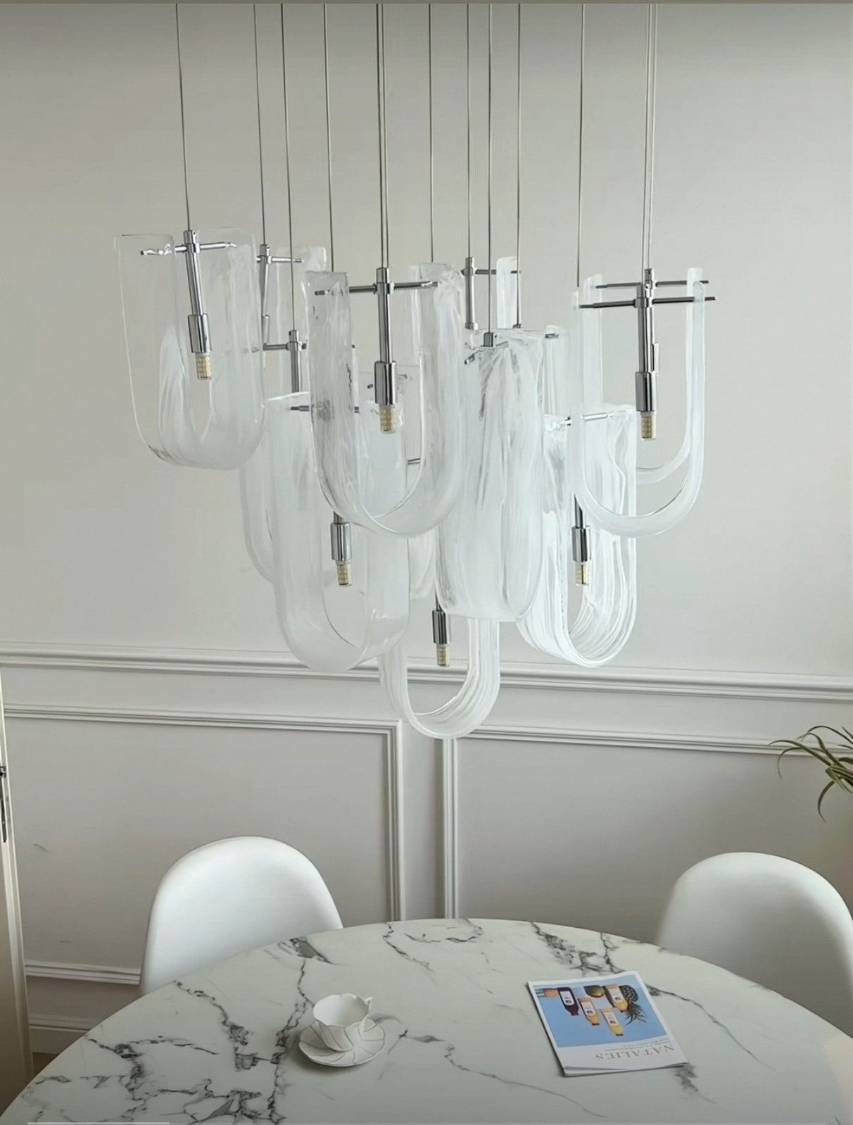 Front view of 19-light Nebula Wave Chandelier, a statement piece for grand spaces