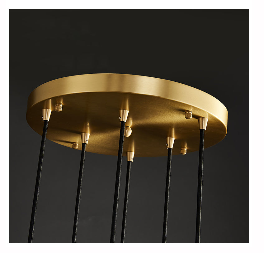 Close-up of the brass canopy and cables on the 10-light model, showcasing craftsmanship.