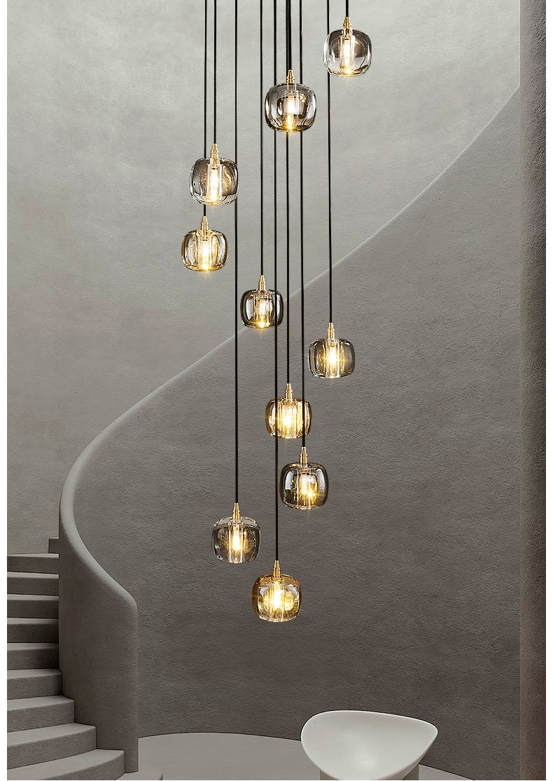 Lifestyle image of the 10-light pendant lights in a grand foyer, casting a welcoming glow.