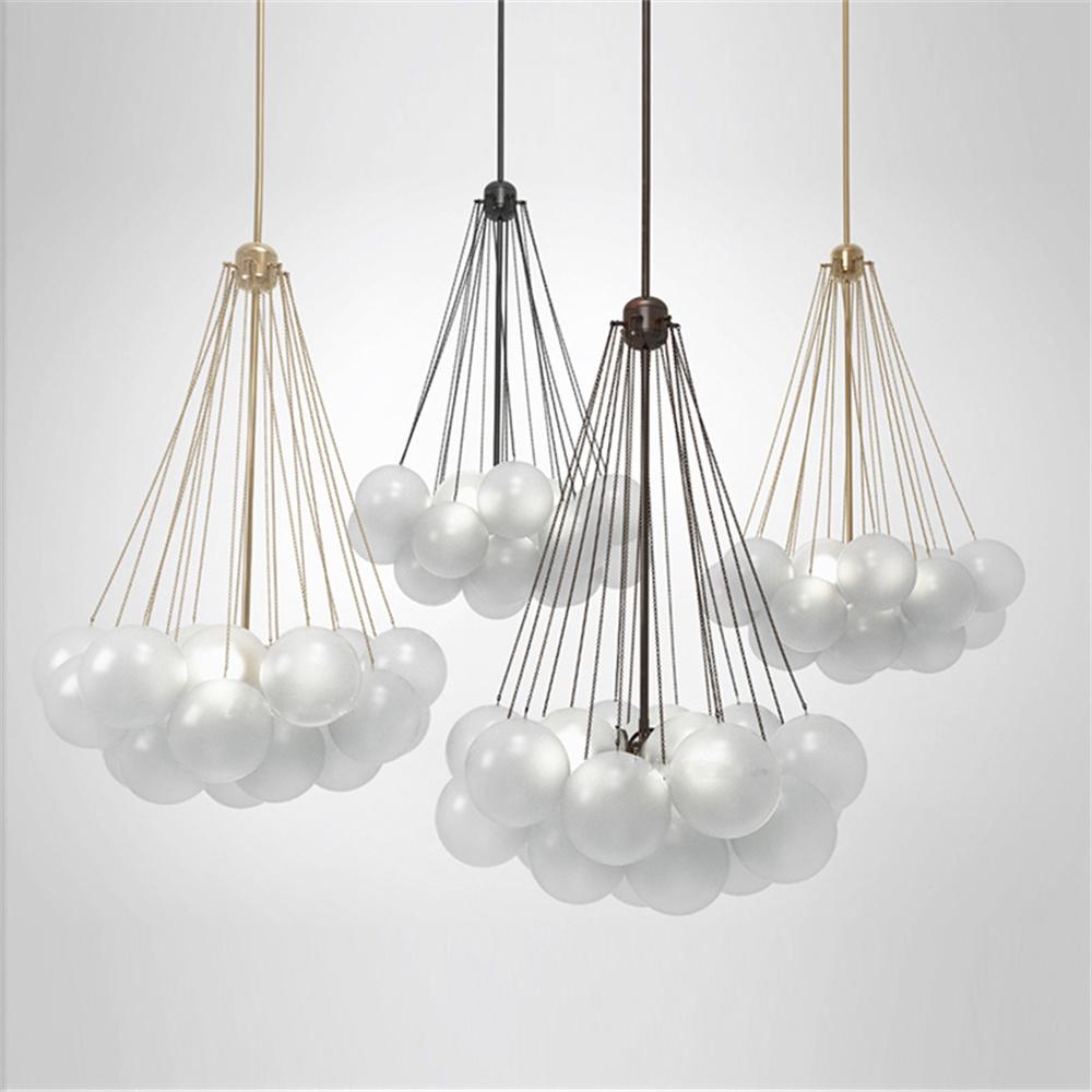 Black pendant lights over island