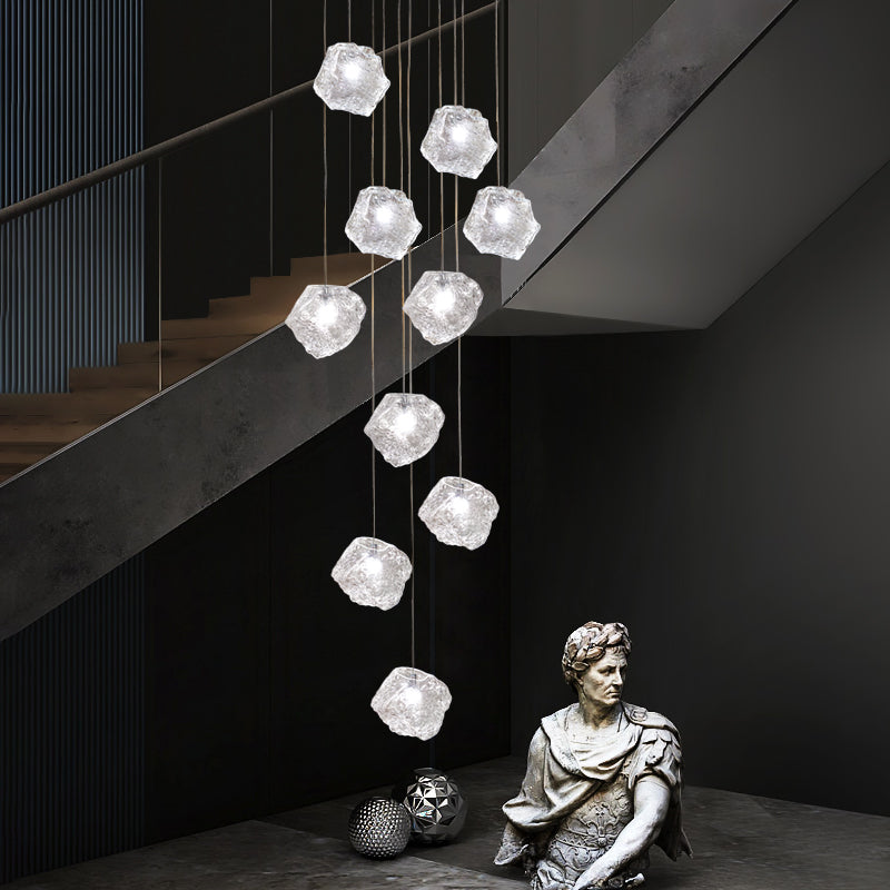 Dynamic low-angle shot of the Aria Sculptural Chandelier, showcasing the cascading arrangement of its 10 stone glass globes.