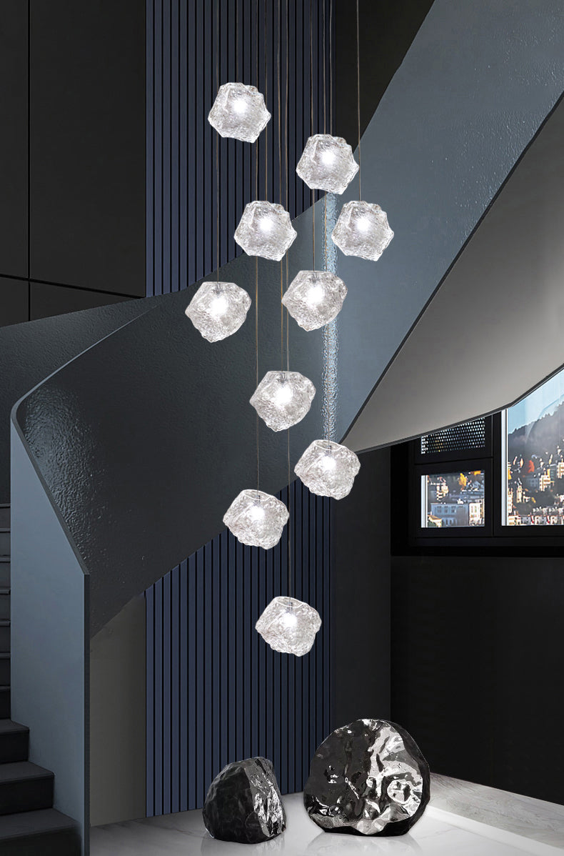 The Aria Stone Glass Chandelier in a satin chrome finish with 9 luminous, veined glass shades.