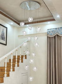 Thumbnail for The 25-light chandelier in a grand foyer, radiating timeless elegance.