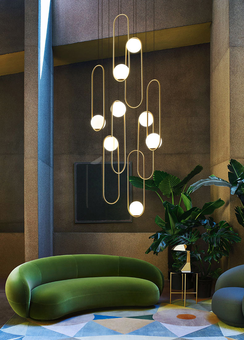 Modern living room chandelier in gold finish, exuding contemporary elegance in a stylish living space with adjustable height.