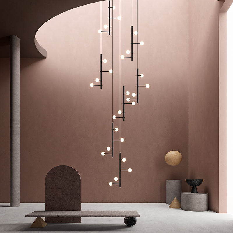 A composition showing the scale of the linear chandelier in relation to other modern furnishings.