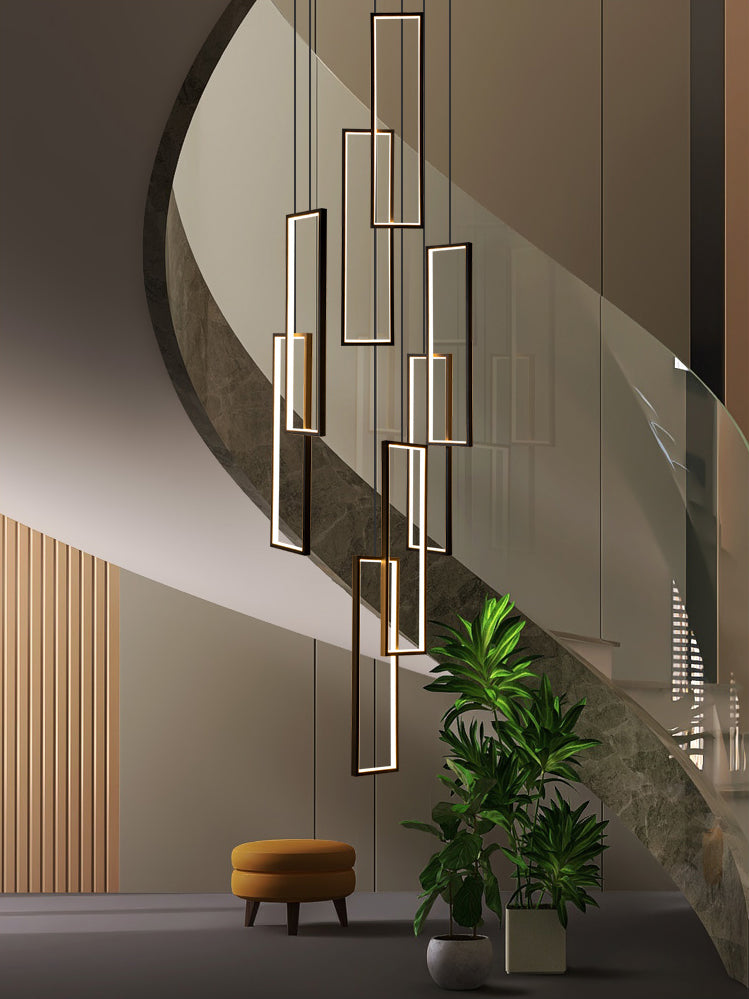 Lifestyle image of the chandelier in a modern foyer, casting a welcoming glow.