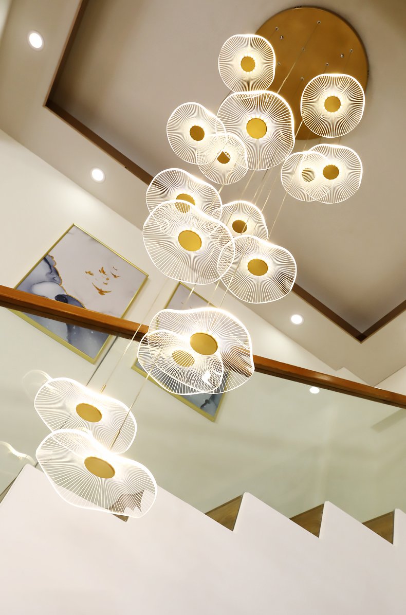 Luminous Strata pendant illuminated with crisp white light, offering a bright and modern feel.