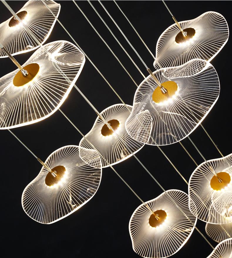 Close-up detail of the translucent acrylic tiers of the Luminous Strata pendant, diffusing a soft light.