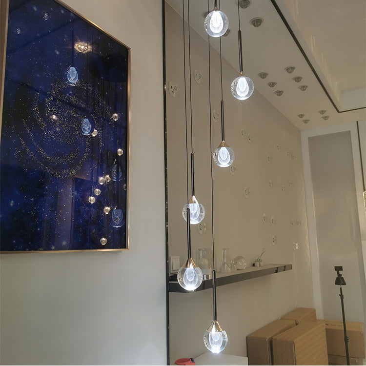 Lifestyle image of the 6-light chandelier in a modern dining room, creating a sophisticated ambiance.