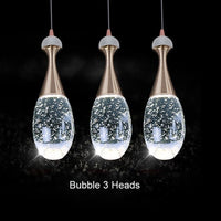 Thumbnail for clear glass pendant light over dinning table