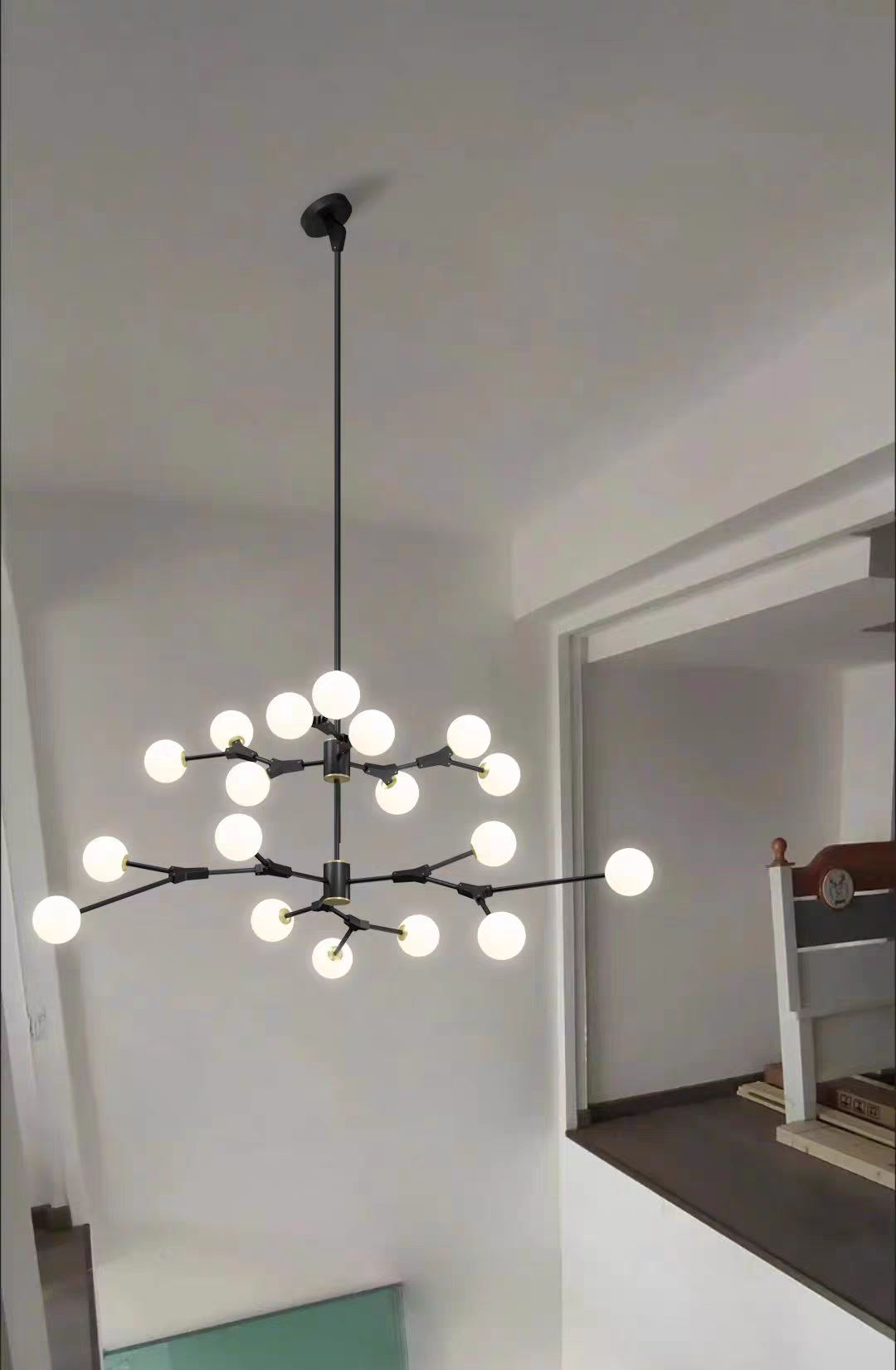 The 18-light Branches Chandelier, captured from the front, is ideal for smaller spaces with artisanal charm.