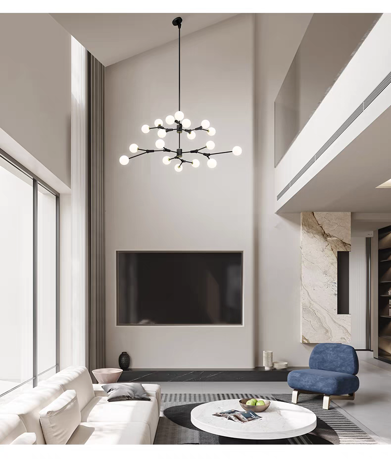 Artistic black branch chandelier as a statement piece in a modern living area with neutral-toned sofa.