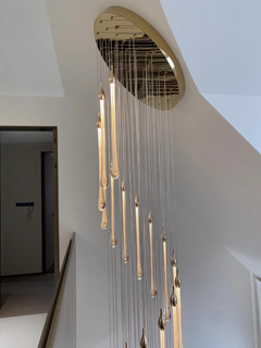 Detailed view of the chandelier’s gold canopy and LED integration, showcasing craftsmanship.