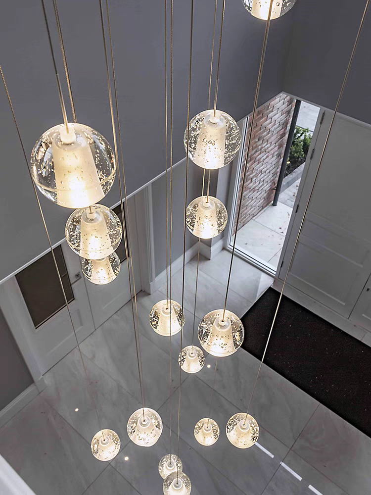 Lifestyle image of the 26-pendant chandelier in a luxurious living room, adding sophistication.