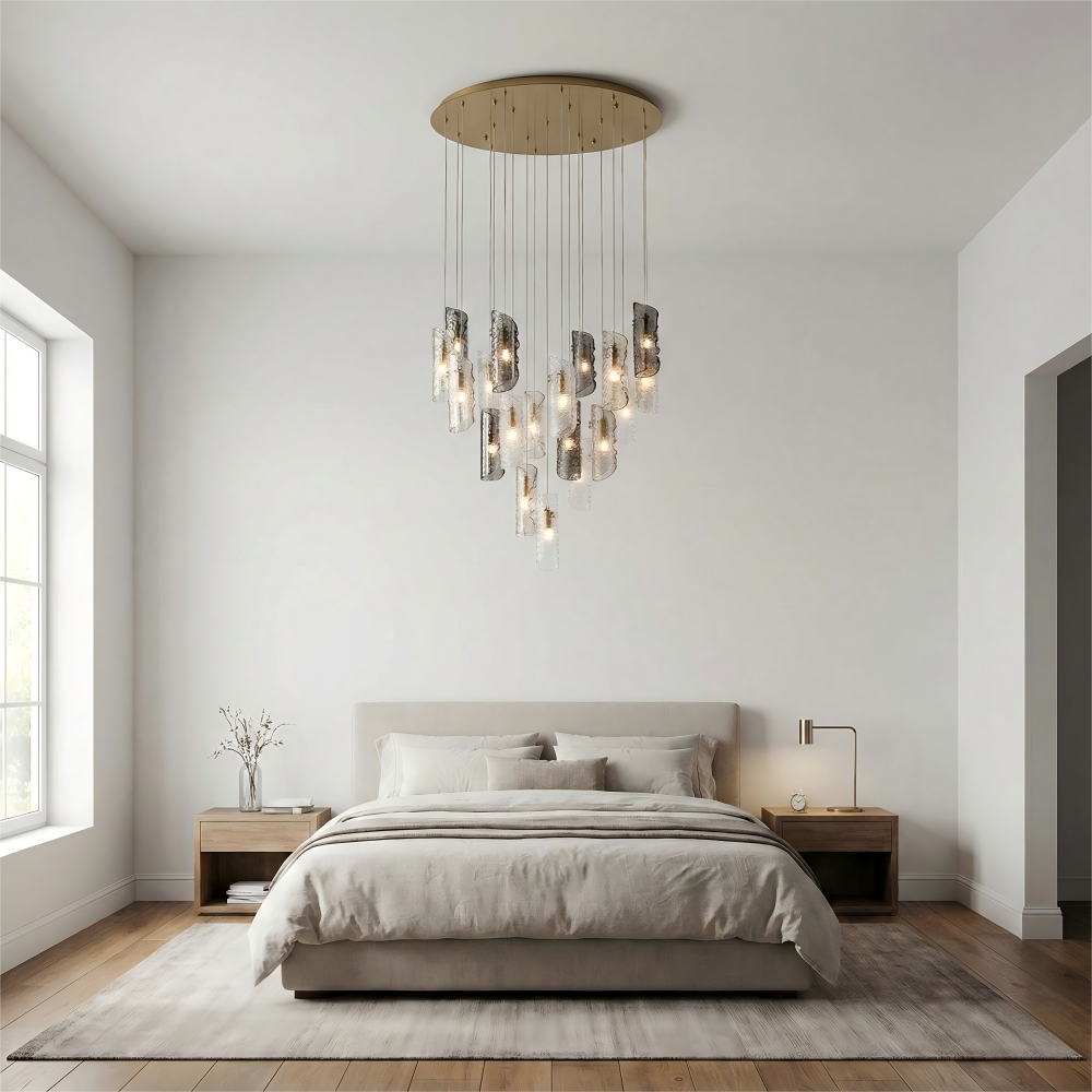 Modern bedroom with a chandelier, bed, and side tables.