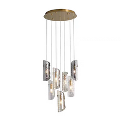Front view of the 7-light Frosted Glass Chandelier, featuring a circular polished brass canopy and cascading frosted glass shades.