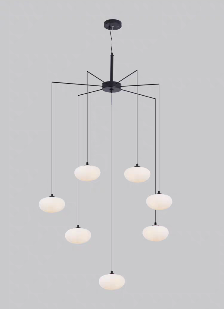 Close-up of a single white oval glass shade, emphasizing its clean, airy design.