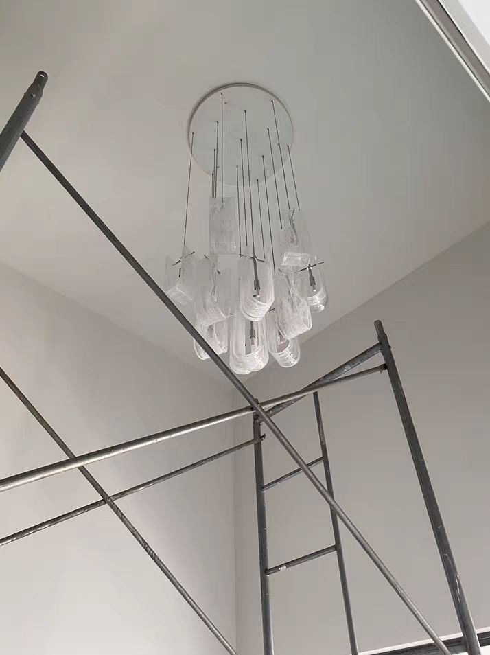 Adjustable hanging cables on Nebula Wave Chandelier, offering flexible mounting options
