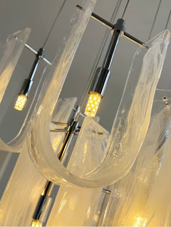LED bulbs installed in Nebula Wave Chandelier, providing energy-efficient warm white light