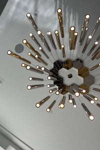 Thumbnail for Top view of Aurorae Shop’s Sparkling Long Cylindrical Chandelier, showcasing chrome cylinders and sparkling light effect.