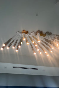 Thumbnail for Fully lit chandelier image, highlighting its vibrant, star-like illumination.