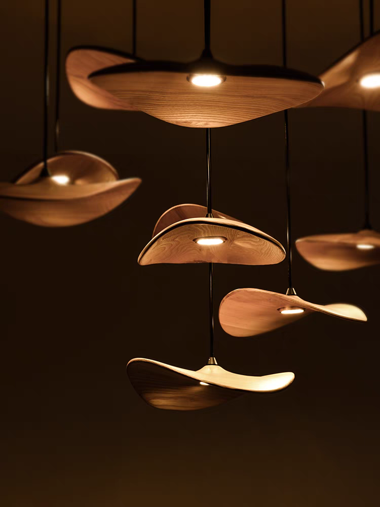 From the side, the 7-light Wooden Shade Chandelier reveals its natural wood texture and light diffusion.