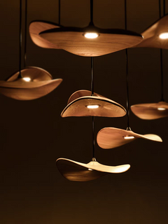 From the side, the 7-light Wooden Shade Chandelier reveals its natural wood texture and light diffusion.