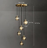 Front view of the 6-light Crystal Brass Pendant Lights, showcasing their shimmering crystal globes and brass finish.