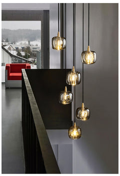 Elegant dining space featuring the Luminous Column pendant as a sophisticated centerpiece.