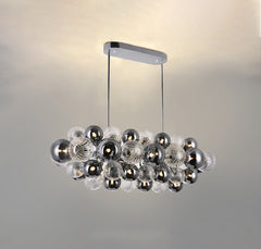Front view of the 28-light Magic Glass Chandelier with rectangular mount, showcasing its linear design.