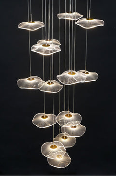 Lifestyle image of the 15-light chandelier  in tiered design and warm LED glow.