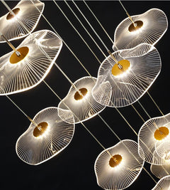 Close-up detail of the translucent acrylic tiers of the Luminous Strata pendant, diffusing a soft light.