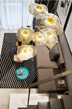 The pendant light in a cozy bedroom, providing an inviting atmosphere.